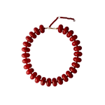 Cleo bright red chunky beaded statement necklace lying flat against a white background